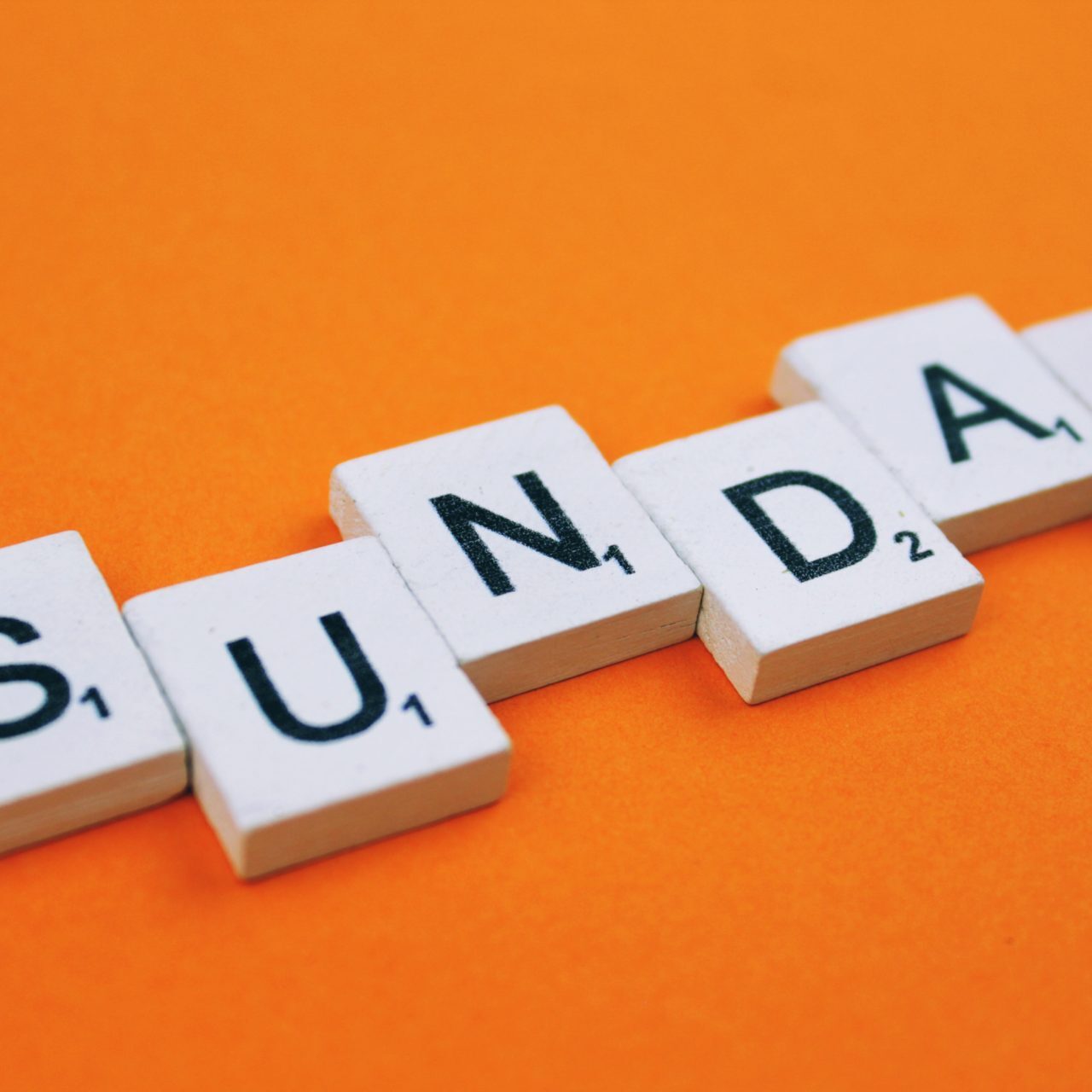 sunday-scrabble-letters-word-on-a-orange-backgroun-2022-11-03-05-22-26-utc